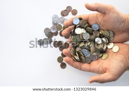 coins in hands, a lot of coins in men's hands, ruble