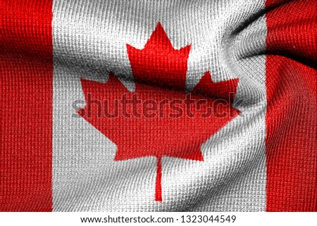 The Flag Of Canada. Illustration on fabric. Warm sweater with red maple.