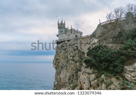 Castle Swallow's Nest on a rock at Black Sea, Crimea, Russia. It is a symbol and tourist attraction of Crimea. Scenic panoramic view of the Crimea southern coast. Architecture and nature of Crimea.