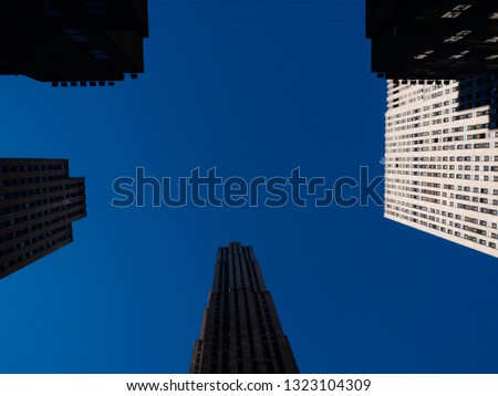 Looking up, building with blue sky and copy space. 
