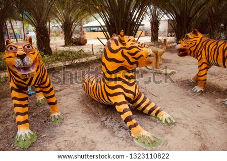 Artificial tigers around an amusement park unique photo