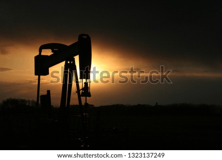 Oil Well at Sunset