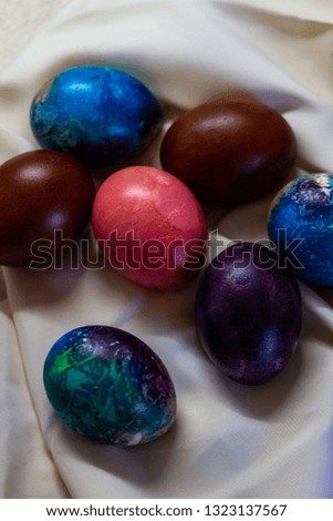 Easter eggs painted in pastel colors on a white background.