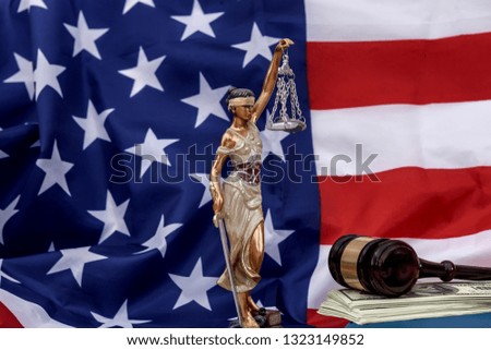 American flag with Themis, dollar and judge's gavel