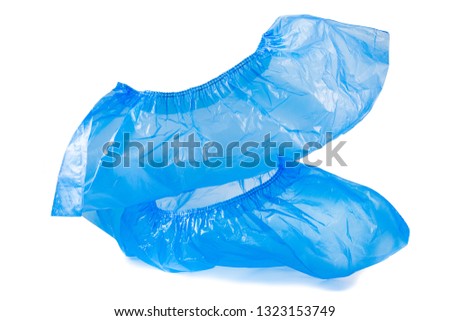 disposable blue shoe covers for hospital visits isolated on white background Royalty-Free Stock Photo #1323153749