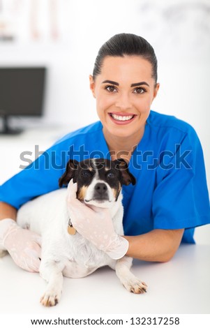 friendly female vet with pet dog