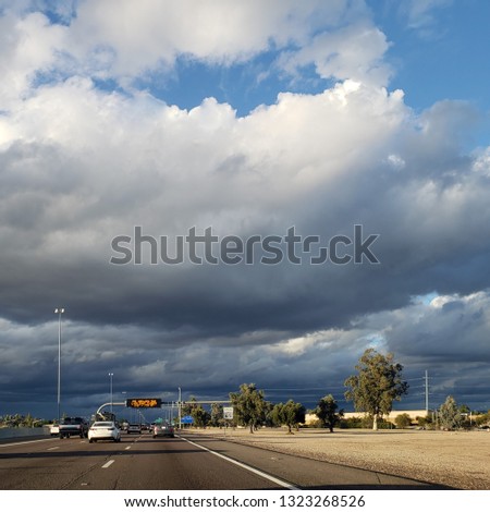 Dense storm clouds moving in North Phoenix metro area right above Interstate 17 highway