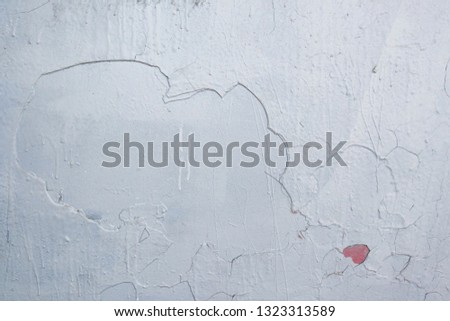 Fancy patterns of plaster on the wall create a contour profile of a woman with a high hair kissing a girl. Not an art, random pattern combination.