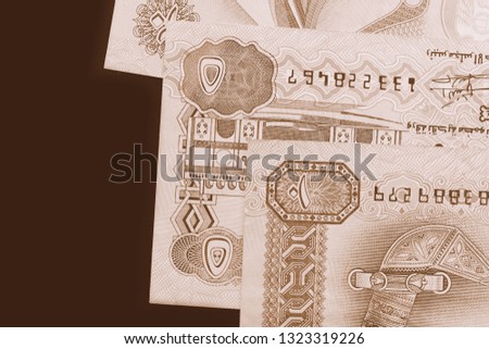 UAE dirham currency background close up. Brown color toned