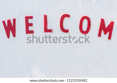 Welcom sign on white wall