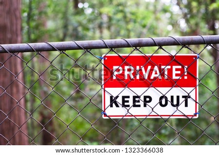 Private Keep Out Warning Sign on Fence