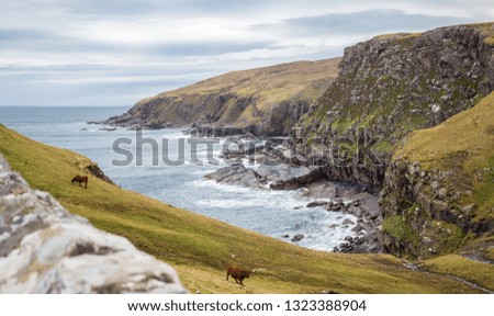 Beautiful view of the ocean and the coast of Scotland in cloudy weather