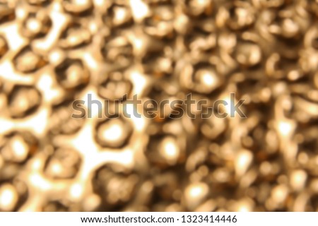 Blurred view of golden bubble wrap as background