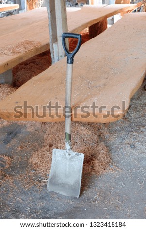 shovel to clean wood waste