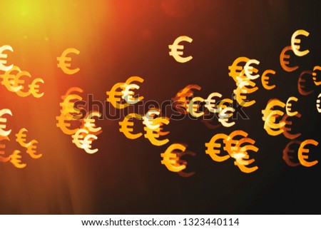 Bokeh as a Euro sign. The concept of wealth and money, trading on the stock exchange and economic growth, rich.