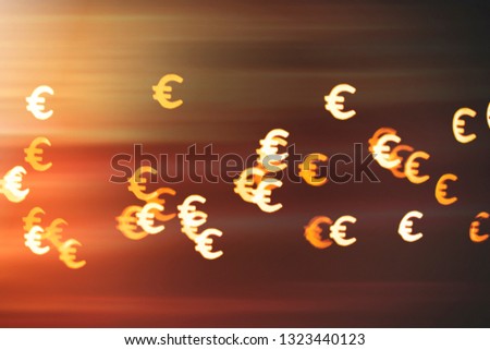 Bokeh as a Euro sign. The concept of wealth and money, trading on the stock exchange and economic growth, rich.