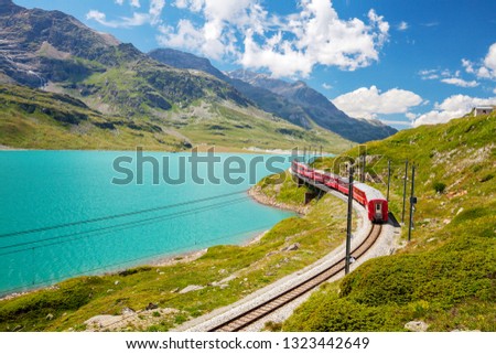 red train - Bernina Pass - Switzerland Royalty-Free Stock Photo #1323442649