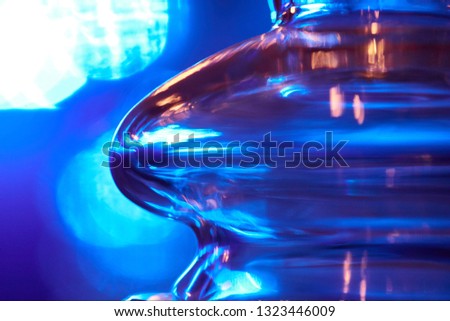 Glass bulb on a blue background. Abstract photo of the glass.