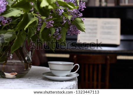 Bouquet of lilac and a cup of tea. Flower, Tea - Hot Drink, Picture Frame, Lilac - Flower, Tea Cup
