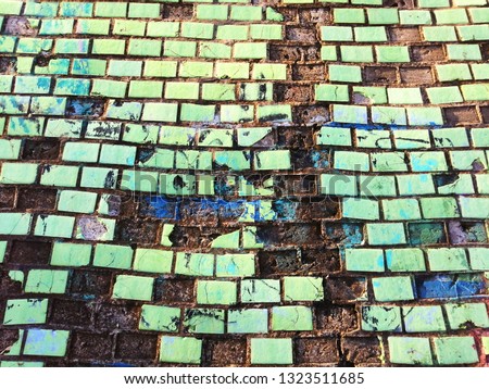 Painted ceramic tile wall. Old mosaic. Texture. Abstract background.