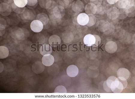 Silver light bokeh as abstract background. Texture