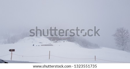 View of a hut in Les Houches amidst heavy snow