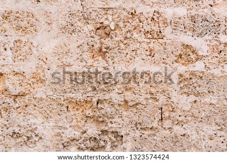Architectural background pattern and textures of a natural stone wall bonded with mortar - Havana - Cuba