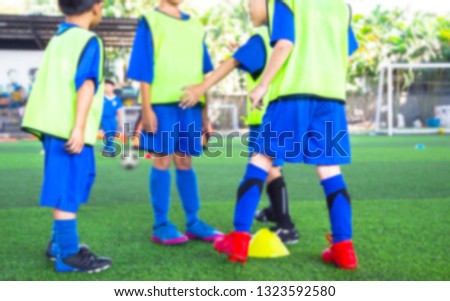 Youth soccer practice drills with cones. Soccer drills: slalom drill. Young football players training on pitch