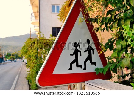 Children crossing sign. Kids running to school. Pay attention and don't drive fast
