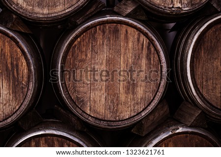 Wine barrels, close up. Wine casks at the winery. Stacked old Wine barrels at the german winery.