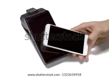 Mobile aPOS smart payment terminal with NFC technology. Close up photo of customer paying contactless with smartphone isolated on white background. Concept for banking, finance and card payments.