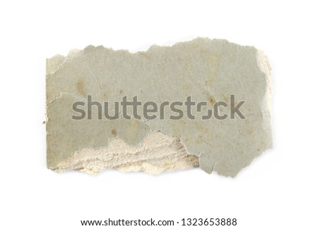 Burned and charred paper scrap isolated on white background, top view