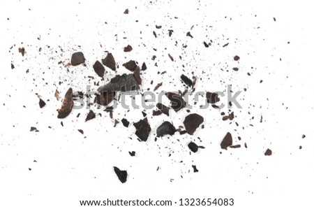 Burned and charred paper scraps isolated on white background, top view