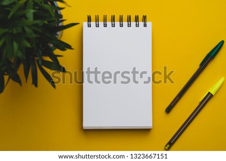  yellow background green notebook