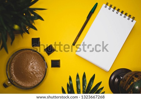 Coffee mug globe photo yellow background green notebook keyboard  free space plants chocolate 