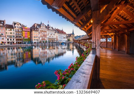 Kapellbrucke historic wooden bridge in Luzern and waterfront landmarks dawn view, town in central Switzerland Royalty-Free Stock Photo #1323669407
