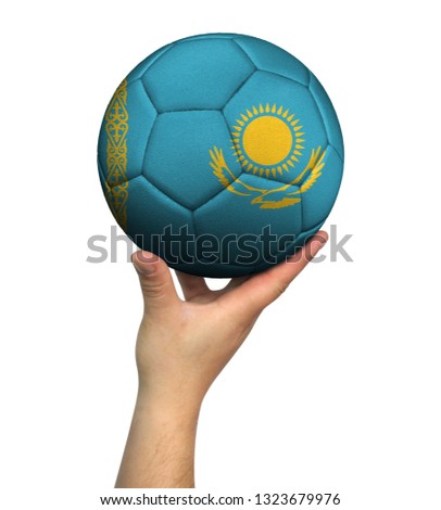 Man holding Soccer ball with Kazakhstan flag, isolated on white background.