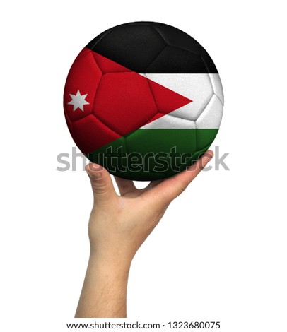 Man holding Soccer ball with Jordan flag, isolated on white background.