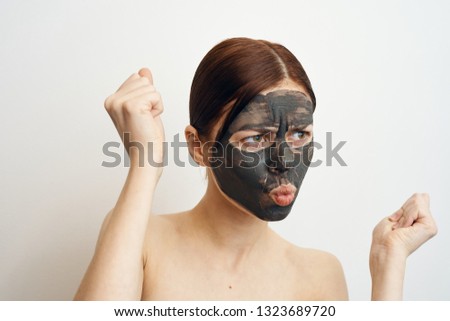 woman in clay mask care