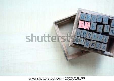 Smile and Stamps in Light wood background for anxiety and other mental health campaign