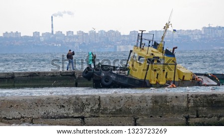 old shipwreck near a sea coast . Sunken towing ship Odessa Ukraine
