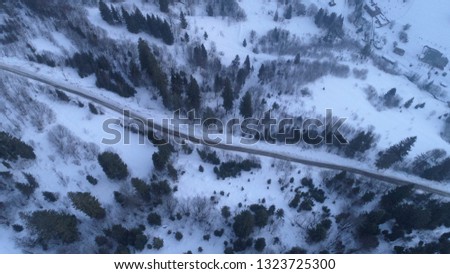 Drone view on the winter forest road