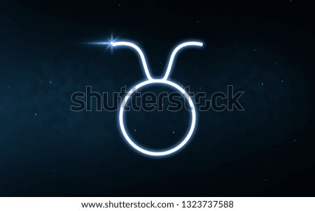 astrology and horoscope - taurus sign of zodiac over dark night sky and stars background
