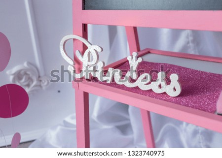 The inscription - Princess. The interior photo zone is framed in pink style.
