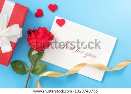 Beautiful greeting invitation card, concept of mother day, Valentine day, anniversary and birthday isolated on blue color background, copy space, top view, mock up, flat lay