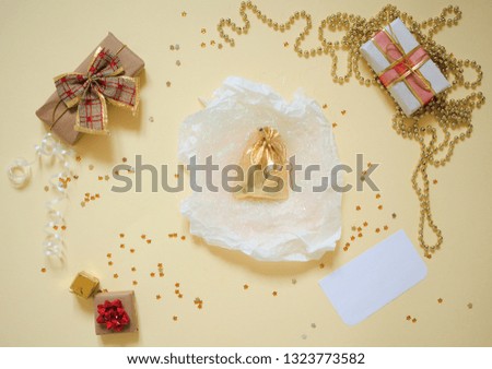 Top view presents on yellow background. Flat lay