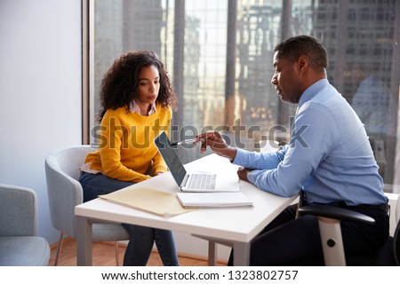 Woman Meeting With Male Financial Advisor Relationship Counsellor In Office Royalty-Free Stock Photo #1323802757