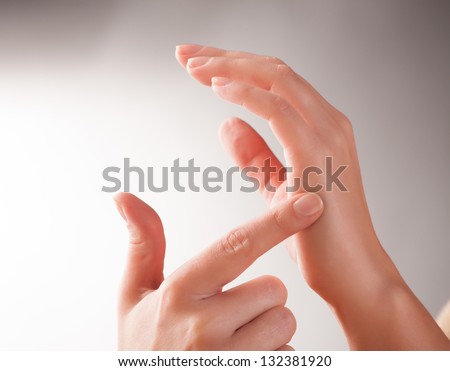 Woman doing EFT on the karate chop point. Emotional Freedom Techniques, tapping, a form of counseling intervention that draws on various theories of alternative medicine. Royalty-Free Stock Photo #132381920