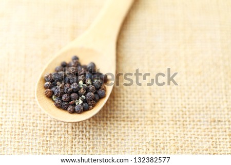 pepper in wooden spoon