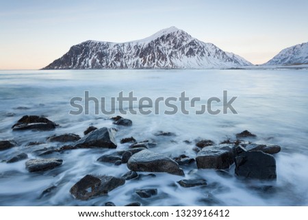 Picturesque sandy beach on Lofoten islands in Norway on sunny winter day 